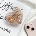 Detail eines herzförmigen Glitzer-Handyhalters mit goldener Schrift und Pailletten - Glitzer Halterung-Herz Englisch / Orange