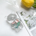Macro detail of clear acrylic bear phone grip featuring a pink floral inlay design - Bear Stand - Pink Tulip + Pink Flower