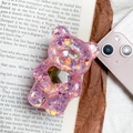 Détail du support de téléphone ours en résine rose avec paillettes et accent cœur doré - Rouge