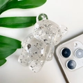 Detailed close-up of transparent bear phone grip with decorative silver foil interior - Clear
