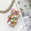 Détail du support téléphone en forme d'ours avec effet laser et fleurs séchées - Fleur réelle irisée-Trois fleurs blanches