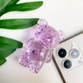 Detailed macro view of the clear purple bear phone grip with glitter and silver foil accents - Transparent Purple