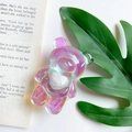 Detail of holographic bear phone grip with white plush heart on aesthetic book - Bear with Heart / Holographic Rainbow