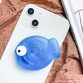 Cute blue fish shaped collapsible phone socket grip with 3D eyes on white phone - Sapphire Blue