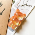 Detail of glitter orange bear phone socket stand with holographic sequins and resin finish - Laser Glitter Orange