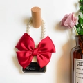 Transparent Z Flip phone case with large red ribbon bow and pearl bead handle on wooden hook - Red / Samsung ZFlip3