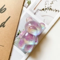 Close-up of a purple glittery bear phone grip with holographic laser resin texture - Laser Glitter Purple