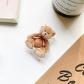 Simpatico supporto per telefono con orsetto di peluche marrone in acrilico - Supporto Trasparente - Orso con Fiocco Rosso