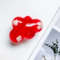 Close-up of cloud-shaped red phone grip with soft white plush contrast details - Red