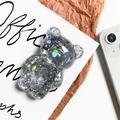 Detailed macro of dark gray transparent bear phone grip with rainbow laser sequins - Gray