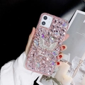 Luxury iPhone case with pink and white rhinestones featuring a large silver swan design - Pink / iPhone 7/8/SE 2020