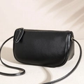Minimalist black cylinder leather shoulder bag with white contrast stitching detail - Black