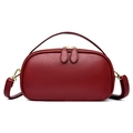 Burgundy lychee grain leather handbag in an oval shape with elegant gold hardware - Red