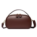 Dark brown pebble leather oval handbag with gold zipper and top handle in studio view - Brown