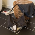 Dark brown retro leather croissant bag with woven strap and spacious crossbody design - Brown