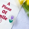 Collapsible flower phone grip with purple tulip and clear base on decorative background - Purple Single Tulip