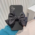 iPhone case featuring a large black satin bow with a sleek minimalist matte finish - Black / iPhone 12