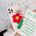 Cream iPhone case with red sunflower charm and smiley face detail on stone background - iPhone 12 Pro Max / White