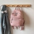 Stylish pink faux leather backpack with lychee texture and silver ring zipper detail - Pink