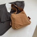 Close-up of brown suede tote bag with practical pockets and visible high-end texture - Khaki