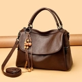 Dark brown lychee pattern leather handbag with vintage wooden charm and long shoulder strap - One Size / Brown