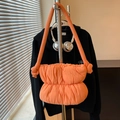 Quilted bright orange cloud bag with puffer texture and thick knotted shoulder strap - Orange