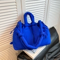 Puffy electric blue bucket bag in quilted fabric with knotted shoulder strap - Blue