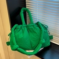 Grass green quilted puffer tote bag with drawstring closure and thick padded shoulder strap - Dark Green