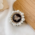 Close-up of luxury phone grip featuring rhinestone butterfly and pearl border detail - Rhinestone Butterfly / Black