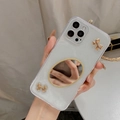 Detail of glitter iPhone case featuring an oval makeup mirror and golden 3D bows - iPhone 7/8/SE 2020 / Glitter Mirror Gold Edge