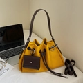 Minimalist yellow leather drawstring bucket bag with dark brown straps and pouch - Yellow
