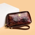 Vintage floral embossed leather wristlet clutch bag in dark brown with gold logo hardware - Red