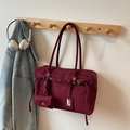 Classic burgundy matte tote bag with leather straps and mini pouch on wooden hanger - Burgundy