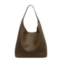 Deep olive green woven leather tote bag with a wide shoulder strap in a minimalist style - Green