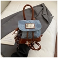 Detail of mini denim and brown leather patchwork backpack with metal drawstring closure - Blue with Pendant
