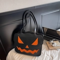 Borsa a spalla zucca di Halloween in pelle nera con viso arancione di Jack-o'-lantern - Nero