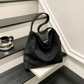 Classic black suede hobo shoulder bag with a spacious interior and soft texture - Black