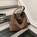 Detailed view of the soft brown suede texture on a large minimalist leopard tote bag - Brown