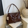 Deep brown faux leather tote bag with vintage texture and stylish buckle strap detail - Brown