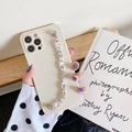 Elegant cream iPhone case with sparkling rhinestone chain strap for a stylish hand-held look - iPhone 7/8/SE 2020 / Off White