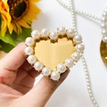Golden heart-shaped phone mirror grip stand with elegant white pearl trim detail - Gold