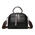 Black leather Boston bag with brown trim and wide shoulder strap in front view - Black