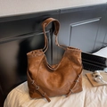 Retro caramel brown leather tote bag with vintage texture and metal buckle detail - Brown
