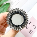 Luxury rhinestone phone socket with mirror center and crystal sunflower design - Black Ring Gemstone Style