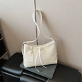Cream woven leather crossbody bag with minimalist shoulder strap and small square tag - Off White