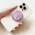 Magnetic MagSafe phone grip with purple iridescent shell pattern on beige smartphone - Threaded Magnetic Stand / Violet