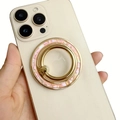 Close-up of golden scallop magnetic phone ring holder with pink shell texture and glitter - Gold Pink Crushed Mother of Pearl