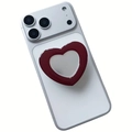 Macro detail of the heart-shaped phone grip with silver mirror and red acrylic frame - Expanding Stand / Chestnut