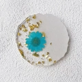 Handmade resin coaster featuring blue dried flowers and gold leaf with scalloped edges - Blue Daisy (5-No Text)