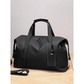Grande borsa da viaggio nera impermeabile con tracolla su una superficie di legno chiaro - Nero Grande